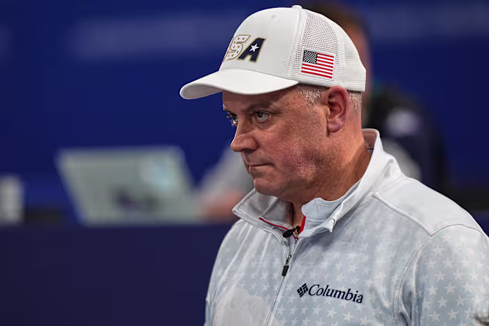 De 54-jarige advocaat uit Minnesota, die met de vader van zijn teamgenoot speelde, wordt de oudste Amerikaanse Olympische Wintersporter